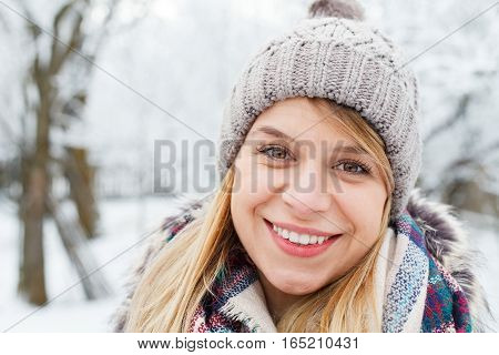 Portrait of a happy young girl on wintertime