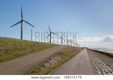 Windturbines along a Dutch dike near Urk