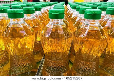 Closed up pile of bottled palm oil in the market