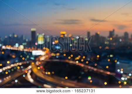 Abstract blurred light city and highway with sunset sky background