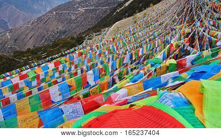 DEQIN CHINA - APRIL 2015 Coloful prayer flag in top of snow mountain at Deqin Yunnan China