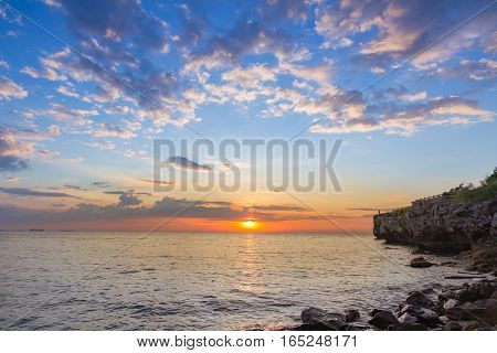 Sunset over the seacoast skyline with beautiful natural sky natural lanscape background