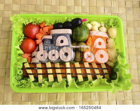 The train is made of rice. Kyaraben, bento. Creative food for children