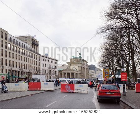 BerlinBundesrepublik Deutschland- December 292016: Brandenburg Gate - the only surviving city gate their original name - the Gate of the world. They were built by Carl Gotthard Langhans in 1789-1791 gg.Tourists walk at the gate