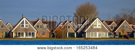 Panorama Holiday resort houses on the waterfront of lake Sneekermeer in Terherne Friesland