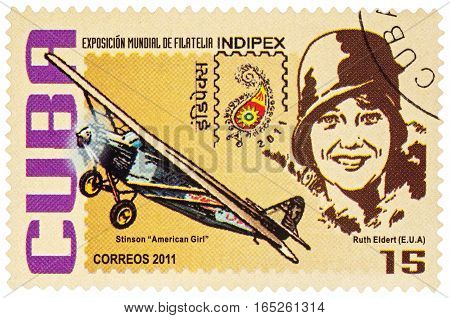 MOSCOW RUSSIA - January 15 2017: A stamp printed in Cuba shows American pilot Ruth Elder and her airplane Stinson 'American Girl' series 