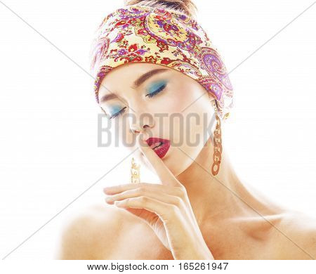 young pretty modern girl with bright shawl on head emotional posing isolated on white background, asian people ethnicity