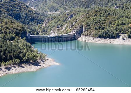 Bubal's Dam Surrounded Of Pine Trees And Water In Pyrenees, Spain