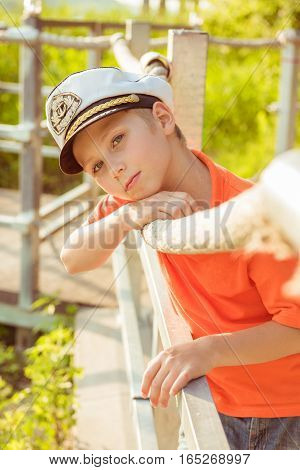 Beautiful boy is about rope in the captain's cap