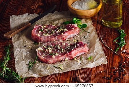 Two Rib Steaks with Spices Prepared for Frying.