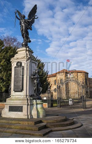 The magnificent Colchester War Memorial with Colchester Castle in the background in Colchester Essex.