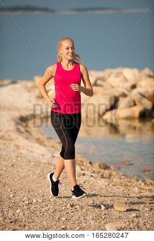 Jogging In Th Beach - Woman Runns Near Sea On Early Summer Morning