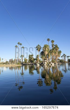 Phoenix downtown as seen across the lake in Encanto Park Arizona; Copyspace