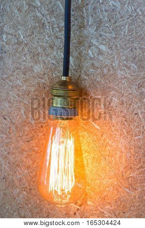 Vintage hanging light bulb decorated on brown wall stock photo