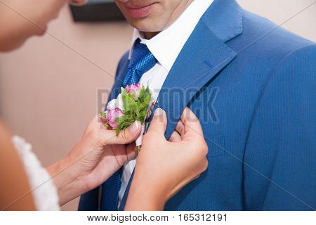 wedding boutonniere on suit of the groom. wedding details