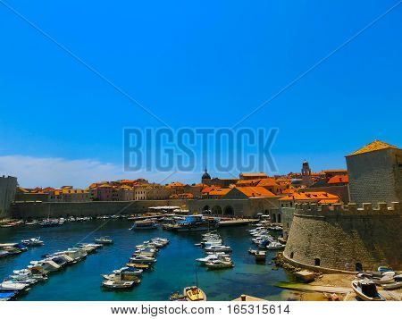 Dubrovnik Croatia - June 07 2015: View on the fortress and marina in the old town of Dubrovnik Croatia. Dubrovnik is a UNESCO World Heritage site
