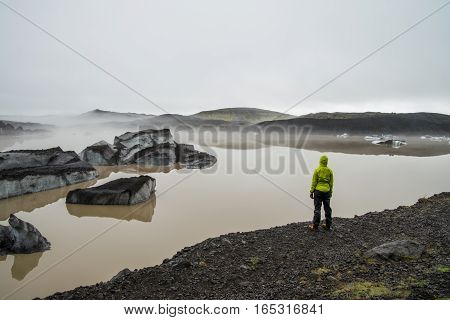 Girl standing near glacier lagoon in Iceland