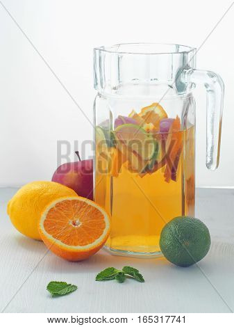 Cold fresh lemonade drink. Refreshing summer sangria. Homemade punch with fresh fruits and mint leaves.
