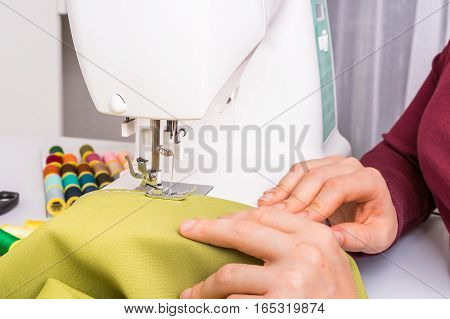 Fashion Woman Sews With Sewing Machine