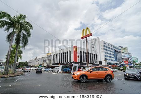 Bandar Seri Begawan,Brunei-Nov 11,2016:View on the main street in Bandar Seri Begawan,Brunei with buildings and a walkway,cars on the road in the background.