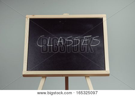 Classes Written In White Chalk On A Black Chalkboard