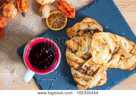marple and pecan plait pastry sweet food breakfast with tea cup
