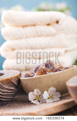 Spa and wellness setting with natural soap candles and towel. Beige dayspa nature set with copyspace