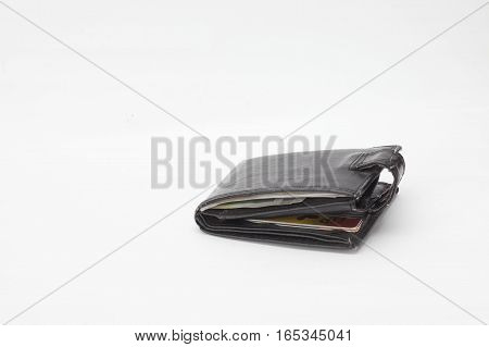 A black wallet with cards on a white background