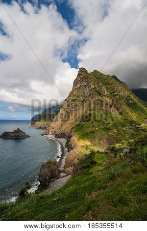 Green landscape of Madeira coastline with cliff