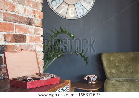 Stylish room corner with vintage telephone and coffret
