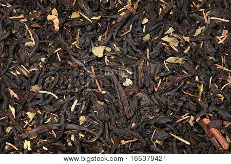 Black tea with brotherwort herb background up-close