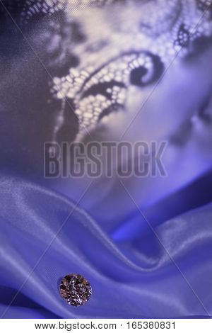 Amazing diamond on vintage dark blue pattern background with soft light.