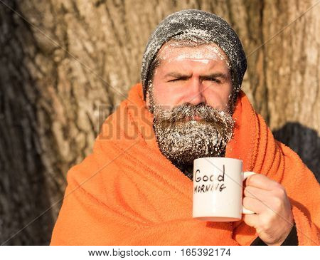 Man In Blanket With Cup