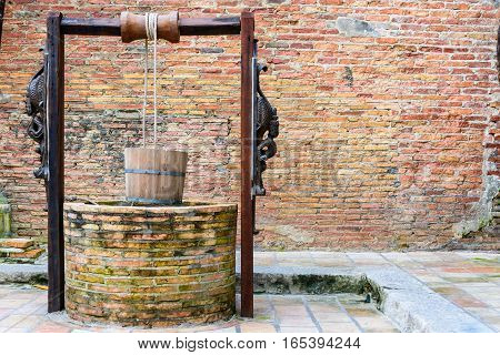 Artesian wells made of brick and wood
