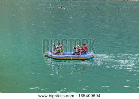 QUILOTOA, ECUADOR, FEBRAURY - 2016 - People rafting at quiet lake at Quilotoa volcano Latacunga Ecuador