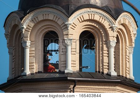 Vilnius Lithuania - October 1 2016: Bell-ringer in the belfry of Our Lady of the Sign Church the orthodox church in Vilnius Lithuania.