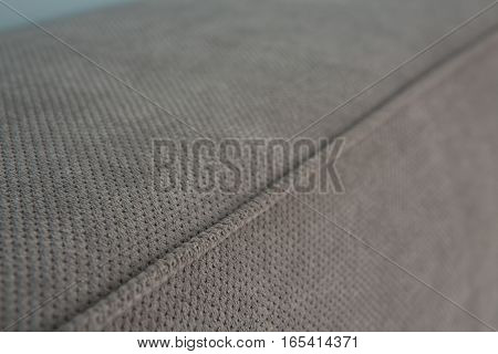 Texture of mattress with no pattern and pictures. Grey colored mattress of bed in bedroom. Mattress of bed in bedroom.
