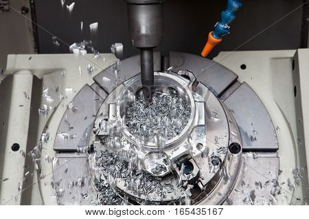 boring metal drilling: drilling hole or boring detail with lubricant liquid coolant on metal cutting