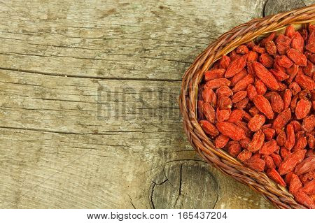 Goji Berries On The Wooden Table. Traditional Chinese Superfood. Healthy Diet Rich In Minerals And V