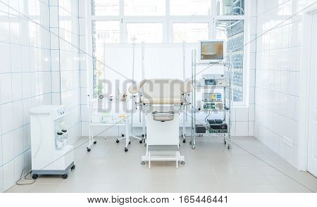 Gynecological Surgery Room With Chair And Equipment