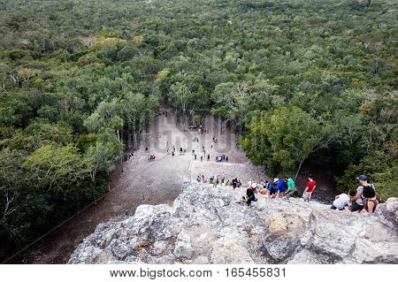 Tourists Climbing The Coba Pyramid