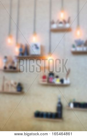 Blurred vintage hanging light bulb on the wall stock photo