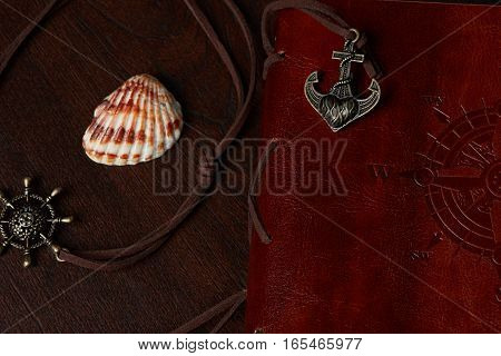 travel journal leather book with compass worls side closeup