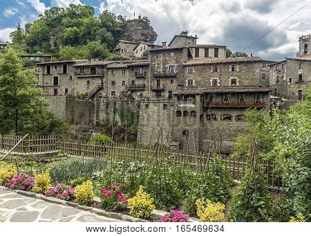 Spain Catalonia . Rupit - mountain village built on top of the basalt rocks in the national park of volcanic origin at an altitude of nine hundred meters above sea level .