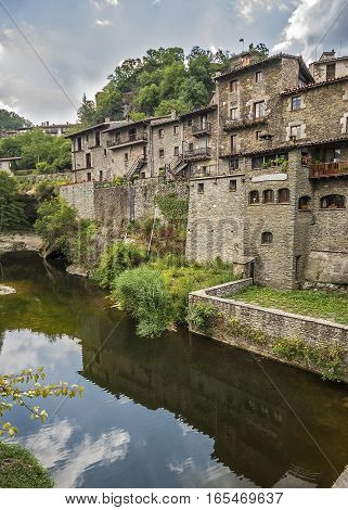 Spain Catalonia . Rupit - mountain village built on top of the basalt rocks in the national park of volcanic origin at an altitude of nine hundred meters above sea level .