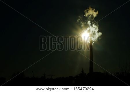 the thick smoke belching from factory chimneys