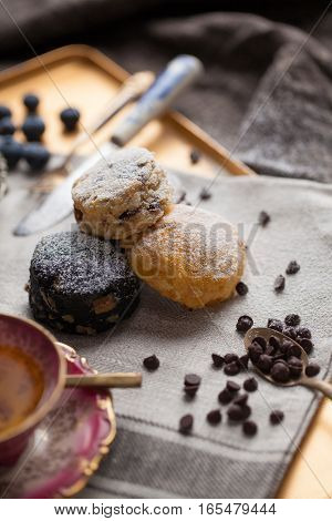 Mix flavour of scone biscuit decorate with chocolate chip and fresh strawberry and blueberry.