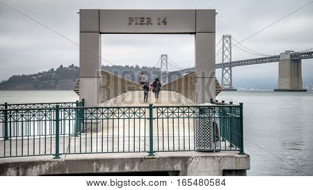 SAN FRANCISCO, CA - September 02, 2014:  Pier 14 in San Francisco with bay bridge in the background