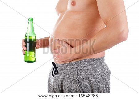 Close up picture of a young man's belly holding a beer