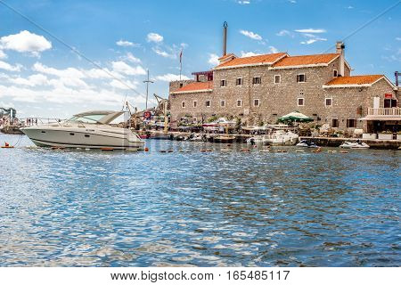 PETROVAC, MONTENEGRO - SEPTEMBER 20, 2016:The old town of Petrovac with an ancient fortress and a bay for tourist and fishing vessels, Montenegro.
